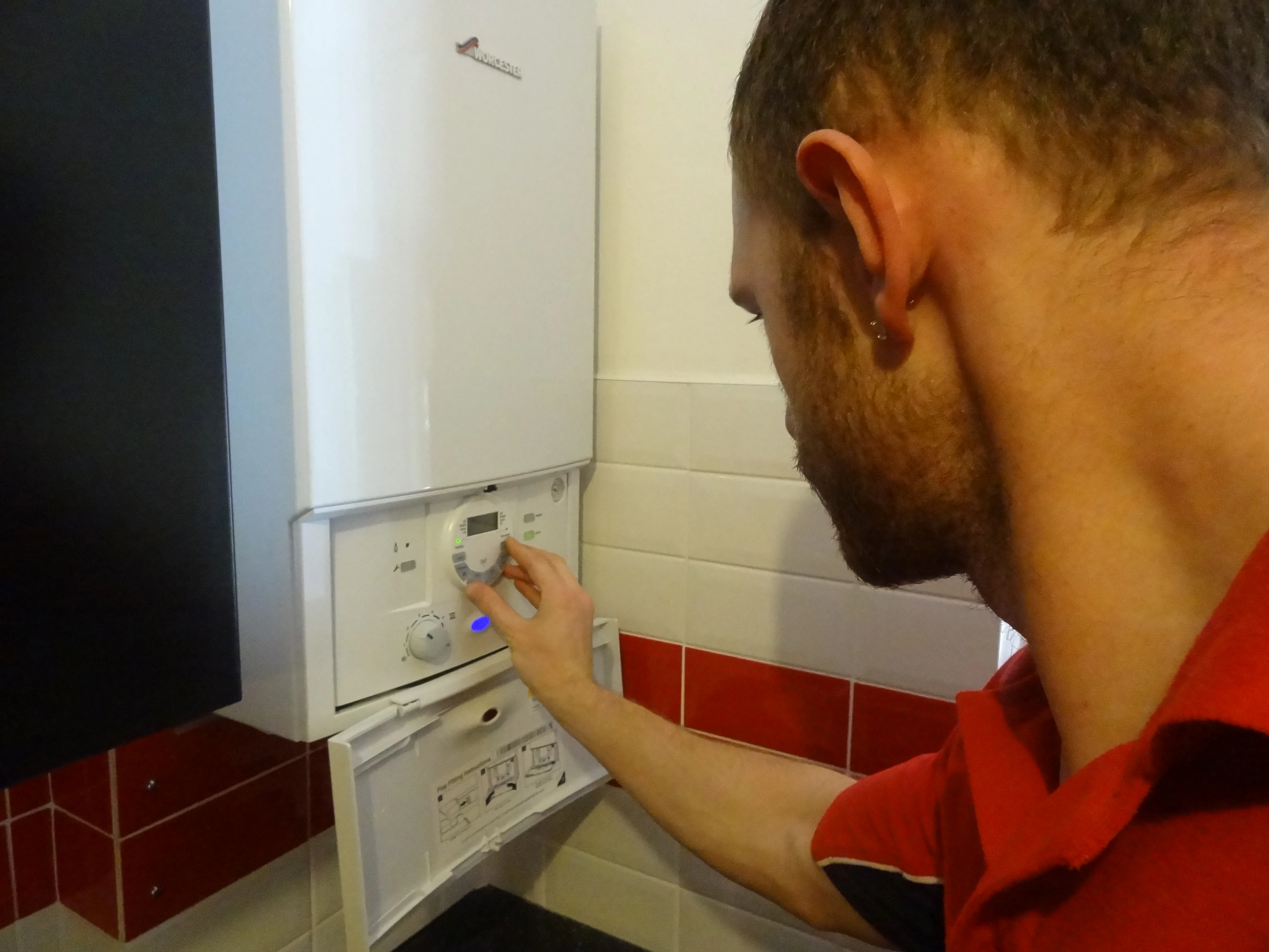 Walton Plumbers engineer working on a boiler installation in Walton-on-Thames